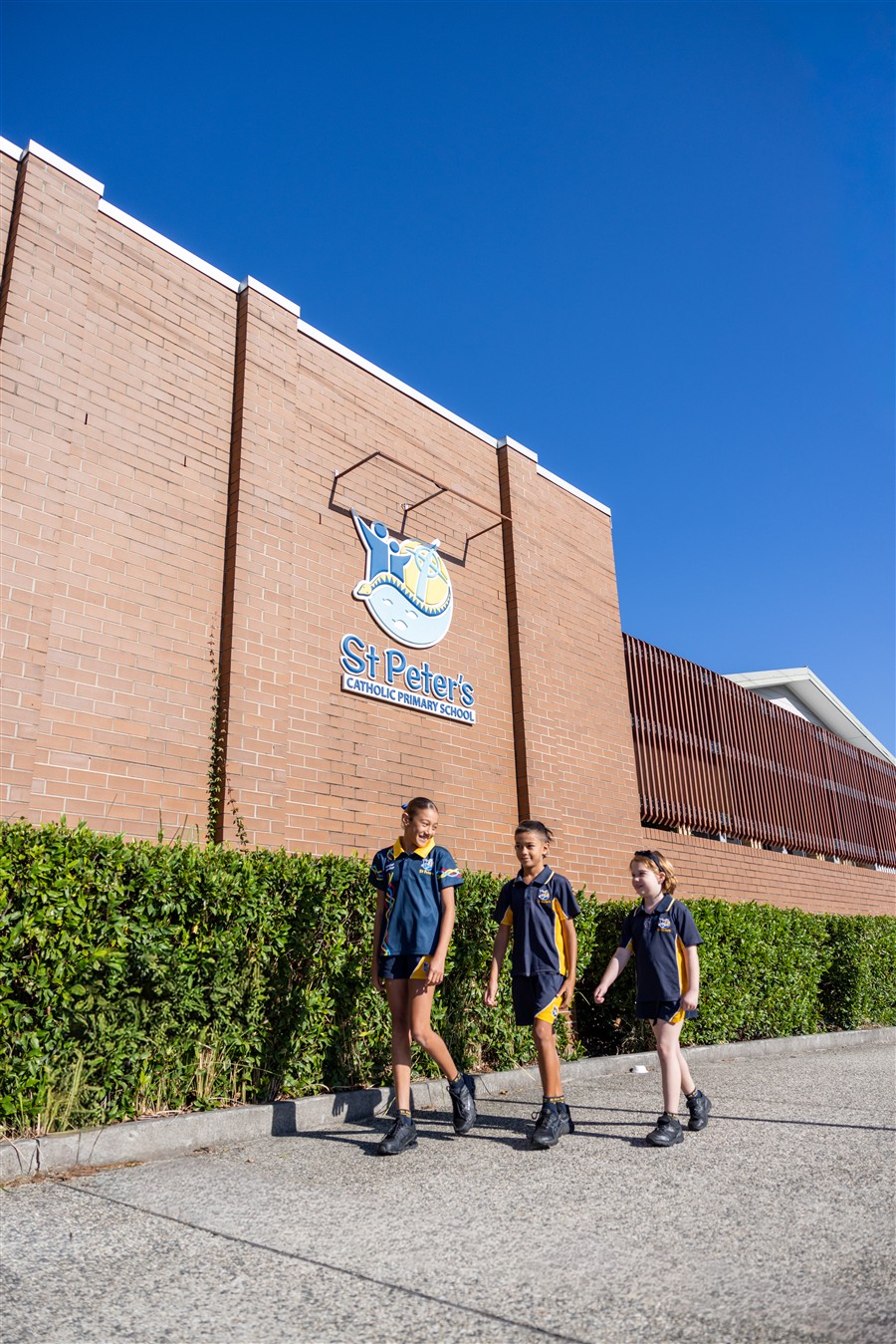 Outside School Gate 3 students walking