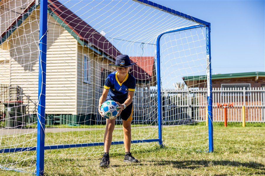 Student in soccer goals 