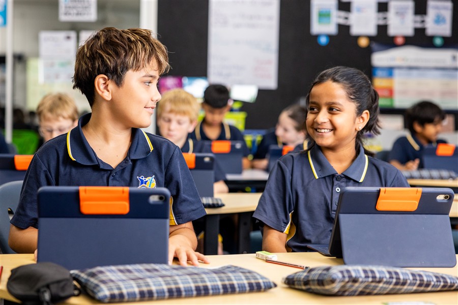 Students in class using iPads