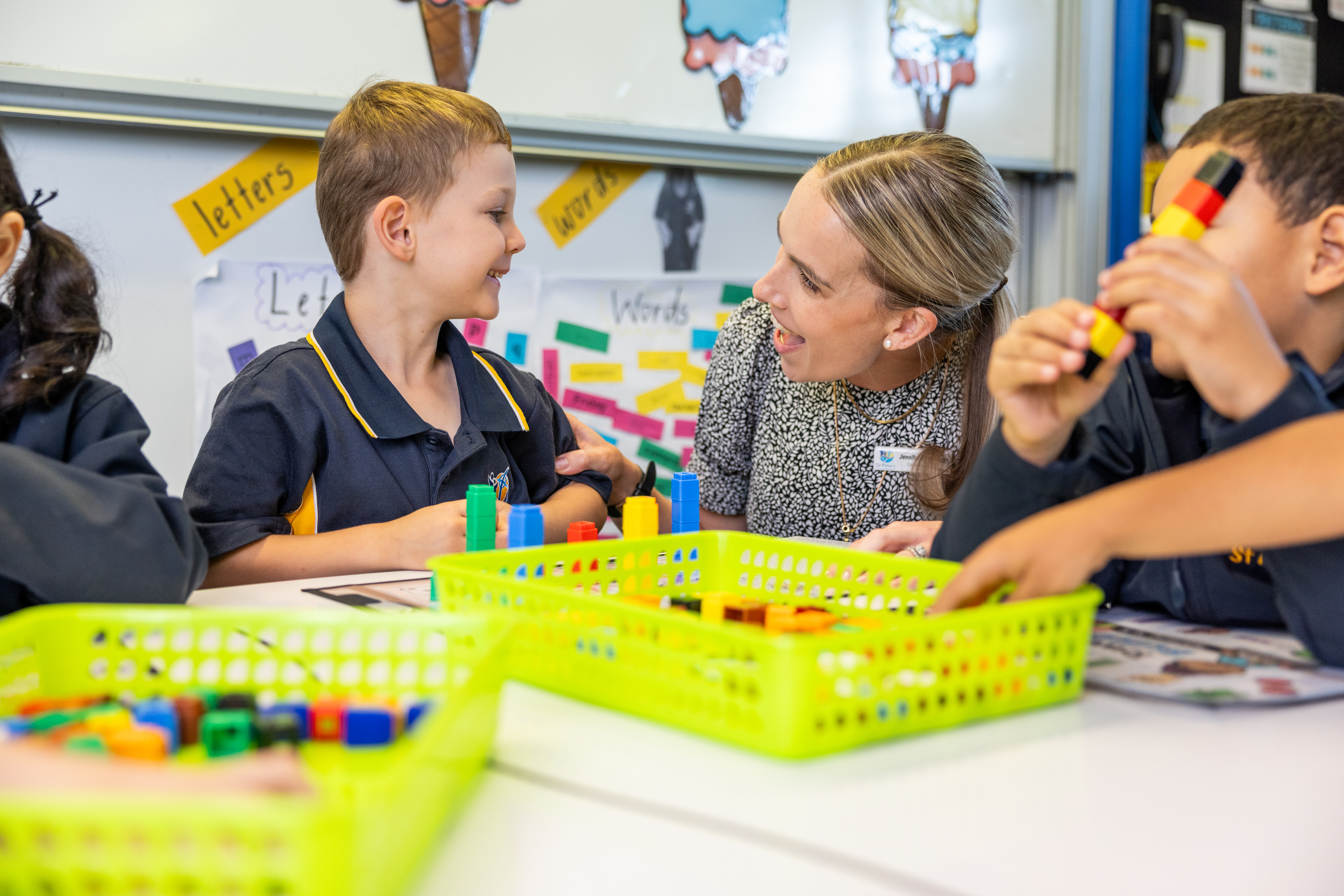 Teacher with student in prep talking 