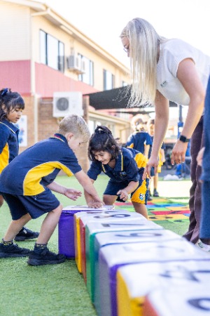 Prep students playing in prep area with giant soft blocks
